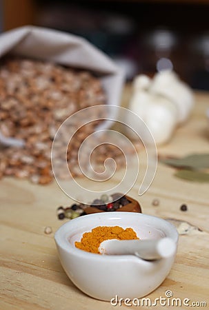 Mortar and Pestle With Turmeric and Chili Peppers Stock Photo