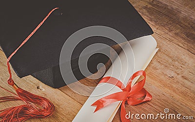 Mortarboard or graduation cap and diploma Stock Photo