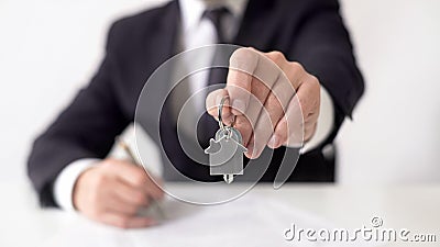 Mortgage broker giving apartment keys to real estate buyer, property contract Stock Photo