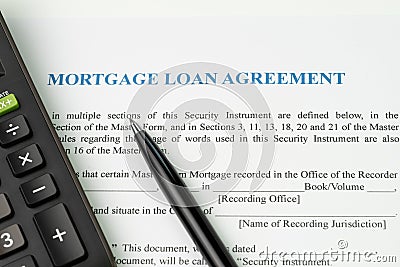 Mortgage loan agreement sign contract concept, pen with calculator on mortgage form or contract, long term debt or real estate in Stock Photo