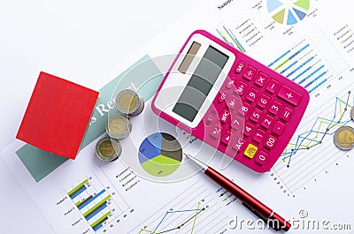 Mortgage loans concept with Red house and coin money and pink calculator and red pen backgrounds above Stock Photo