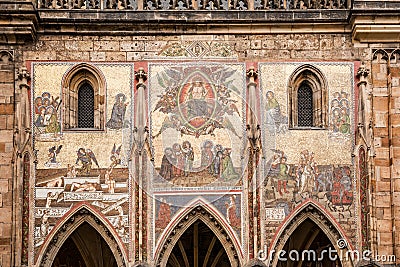 Mosaic on the facade Exterior view of St. Vitus Cathedral in the castle complex in Prague, Czech Republic Stock Photo