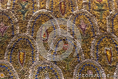 Mosaic of multi-colored stones in the Christian style on the walls of the Orthodox church Stock Photo