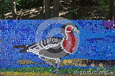 Mosaic with a red breasted goose or branta ruficollis figure made of waste plastic caps Editorial Stock Photo