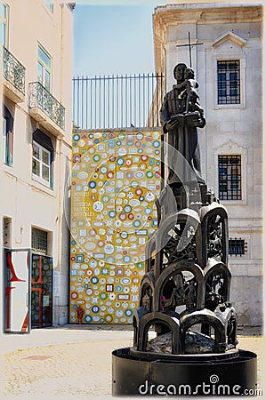 Mosaic and sculpture of St Antony in front of St Antony church and museum, Lisbon, Portugal Editorial Stock Photo