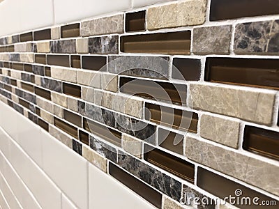 Mosaic tiles made of glass and stone, newly installed on the wall as decoration or kitchen backsplash Stock Photo