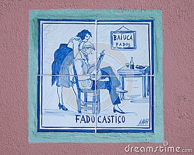 Mosaic tiles representing classical Fado on an outside wall of the small fado restaurant Baiuca in Alfama. Editorial Stock Photo