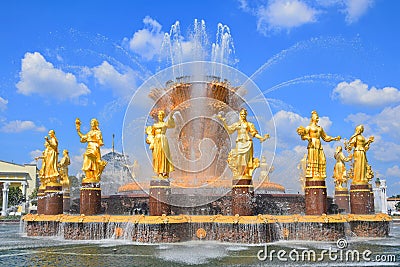 Golden statues of the Friendship of Peoples fountain in VDNKh park Stock Photo