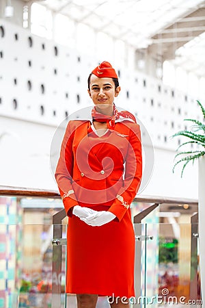 MOSCOW: 01 AUGUST 2019. Beautiful stewardess dressed in official red uniform of Aeroflot Airlines Editorial Stock Photo