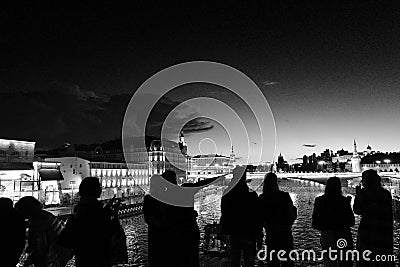 Moscow. Bridge over the Moskva River. Silhouettes of people. Evening walks and excursions. Black and white image. Editorial Stock Photo