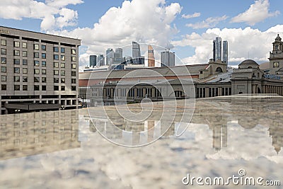 Moscow City and the reflection of skyscrapers from the marble surface. Hotel and the building of the Kyiv railway station. Stock Photo