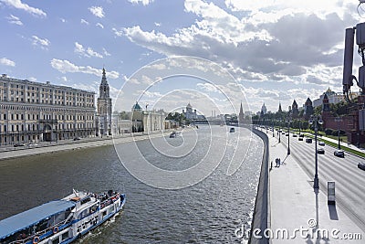 Moscow downtown scene with moskva river and a touristic boat sailing Editorial Stock Photo