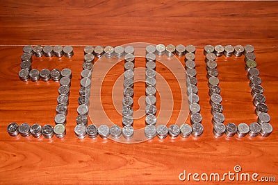 Moscow, 2012-10-15, Five thousand rubles are laid out on the table with the figure of 5000 five-ruble coins Editorial Stock Photo