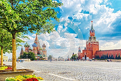 Moscow landscape. Red Square with Spasskaya Tower of the Moscow Kremlin and St. Basil`s Cathedral. Summer sunny day Editorial Stock Photo