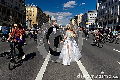 MOSCOW - MAY 21, 2022: Wedding couple during Bicycle parade in the center of Moscow on May 21, 2012, Moscow, Russia Editorial Stock Photo