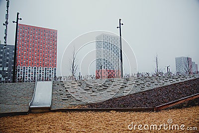 new modern multi-storey building district in new Moscow in the fog. playground Editorial Stock Photo