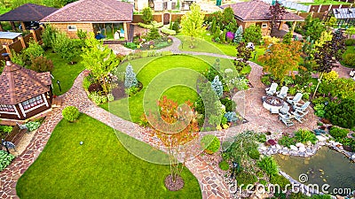 Landscape design at residential house taken from above. Beautiful landscaping in home garden in summer Editorial Stock Photo