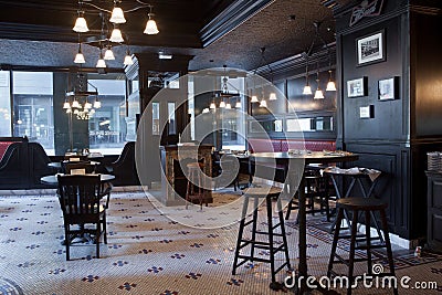 Moscow, Russia - April 04, 2012: Interior of Irish pub, dark colors, in day, no visitors, staff. Restaurant business concept, Editorial Stock Photo