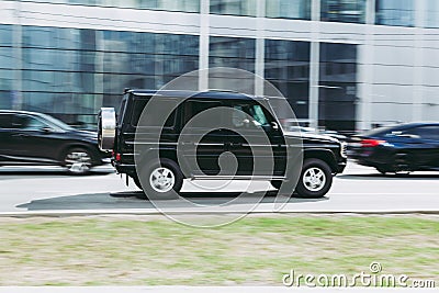 Mercedes-Benz G-Class Gelandewagen in motion with blurred background. Mid-size four-wheel drive luxury SUV drive in city street Editorial Stock Photo