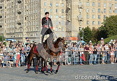 Demonstrative performance by the Kremlin Riding School on Poklonnaya Hill in honor of the Russian Flag holiday. Editorial Stock Photo