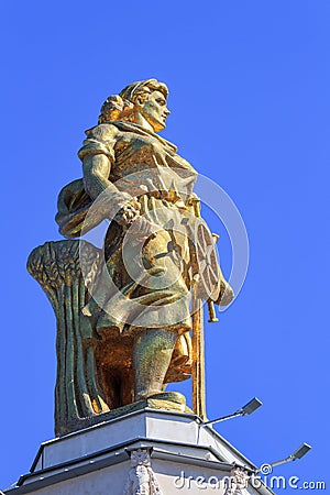 Moscow, Russia - August 01, 2018: Figure of a woman of tractor driver against blu sky on a roof of pavilion Space on Exhibition of Editorial Stock Photo