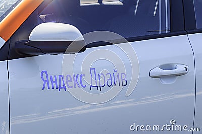 Moscow, Russia - August 01, 2018: Fragment of door of modern car with logo carsharing company Yandex Drive closeup Editorial Stock Photo