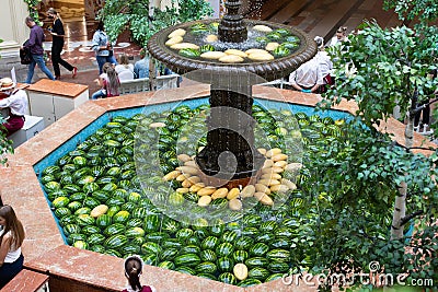 Moscow, Russia - August 24, 2020: GUM large fountain decorated for the harvest festival. Stone fountain filled with fresh Editorial Stock Photo