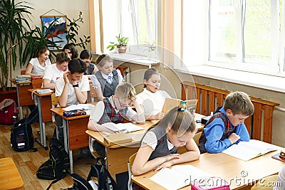 Moscow,Russia-August 16,2016-Little schoolboy sitting behind school desk during lesson in Russian school Editorial Stock Photo
