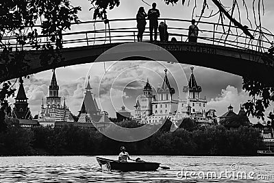 MOSCOW, RUSSIA - AUGUST 6, 2018: People go boating on a silver-grape pond near the Kremlin Izmaylovo Editorial Stock Photo