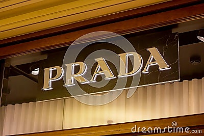 MOSCOW, RUSSIA - AUGUST 10, 2021: Prada brand retail shop logo signboard on the storefront in the shopping mall. Editorial Stock Photo