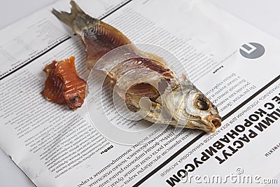 MOSCOW / RUSSIA - 24/05/2020 close up top view shot of a dressed dried salted vobla Caspian Roach fish, its separated head and Editorial Stock Photo