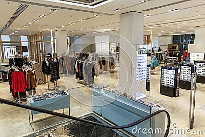 Moscow, Russia, 23/03/2020: A collection of women`s clothing in a modern shopping center. The interior of the hall Editorial Stock Photo