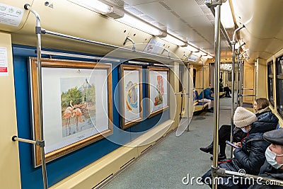 Moscow, Russia -26 Dec. 2021. Watercolor - name train with paintings in the Moscow metro Editorial Stock Photo