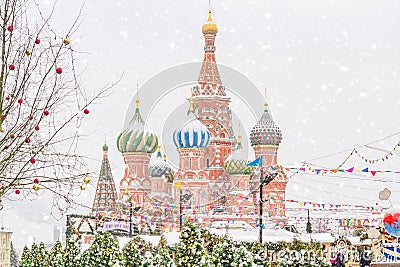 Moscow, Russia - December 20: Christmas decorations on Red Square in Moscow on background of St. Basil`s Cathedral. Winter holida Editorial Stock Photo