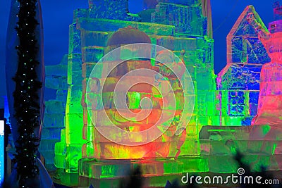 Moscow, Russia - December 2017: ice sculptures highlighted by green, orange and pink colors. Editorial Stock Photo