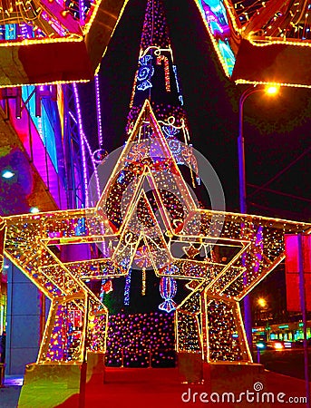 MOSCOW, RUSSIA - DECEMBER 2018: New Year 2019 and Christmas New Year`s decoration of a street in the form of a tunnel of stars Editorial Stock Photo