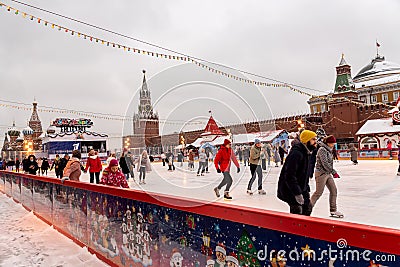 Moscow, Russia - December 15, 2020: People skating on Winter skating rink on Christmas Fair at the Red Square Editorial Stock Photo