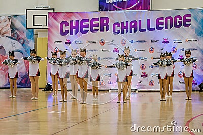 Moscow, Russia - December 22, 2019: Support group little girls begins their cheerleader show at sport competitions Editorial Stock Photo