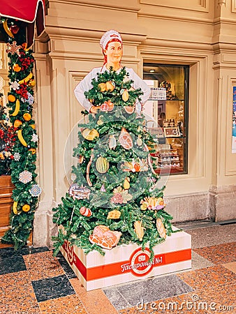 MOSCOW, Russia - December 19, 2018: Unusual fair Christmas trees In the form of Soviet woman seller of Deli number 1 in Editorial Stock Photo