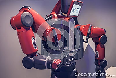 Moscow, Russia - February 11, 2017: Exhibition of Robotics. Stylish handsome cyborg head / Robot Assistant with Information screen Editorial Stock Photo