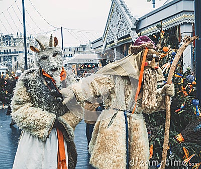 MOSCOW, RUSSIA- FEBRUARY 2017: The mummers walk the streets and entertain the people. Disguised in the wood goblin and Editorial Stock Photo