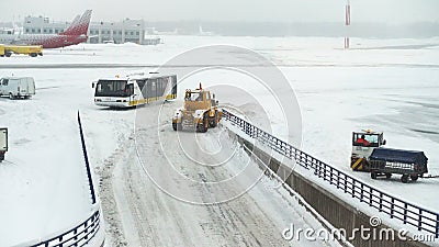 Snow blowers bulldozers graders working at the airport runway. MOSCOW, RUSSIA - FEBRUARY 05, 2018: snow blowers, bulldozers, graders and other machines working Snow blowers bulldozers graders working at the airport runway. MOSCOW, RUSSIA - FEBRUARY 05, 2018: snow blowers, bulldozers, graders and other machines working