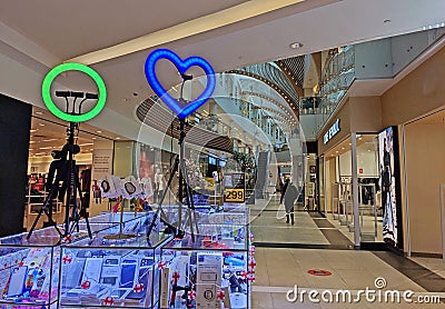 An ordinary ring lamp and a heart-shaped lamp on tripods in a shopping counter in the Vegas Mall Editorial Stock Photo