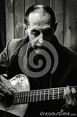 Moscow, Russia January 31, 2021 photo of a bard at a meeting of bards playing in one of the local clubs Editorial Stock Photo