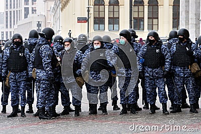 Moscow RUSSIA - January 31 2021: Police officers stand in a cordon on unauthorized political rally in support of the arrested Editorial Stock Photo