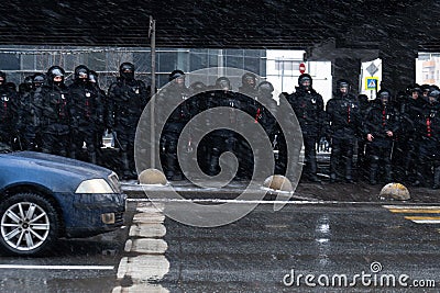 Moscow RUSSIA - January 31 2021: Police officers stand in a cordon on unauthorized political rally in support of the arrested Editorial Stock Photo