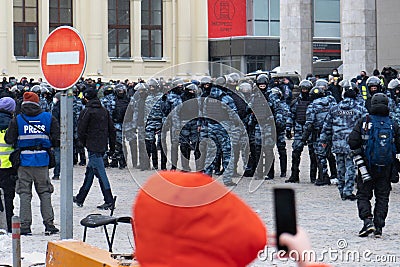 Moscow RUSSIA - January 31 2021: Police officers stand in a cordon on unauthorized political rally in support of the arrested Editorial Stock Photo