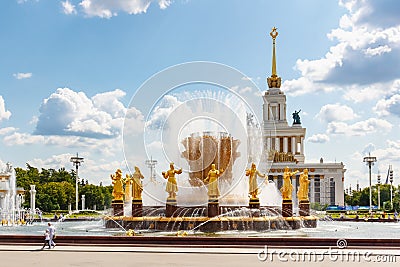 Moscow, Russia - July 22, 2019: Fountain Friendship of Peoples on a background of USSR pavilion in VDNH park in Moscow against Editorial Stock Photo