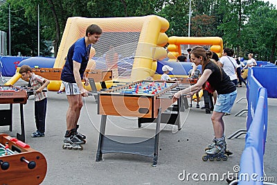 People playing table football in the park VDNKh in Moscow Editorial Stock Photo