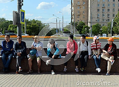 Foreign tourists relax at the metro station `Victory Park` in Moscow Editorial Stock Photo